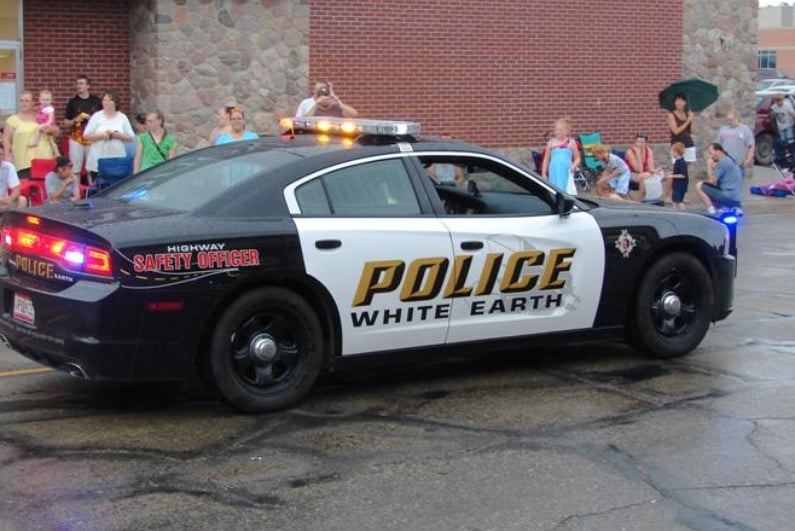 Whtie Earth Police car